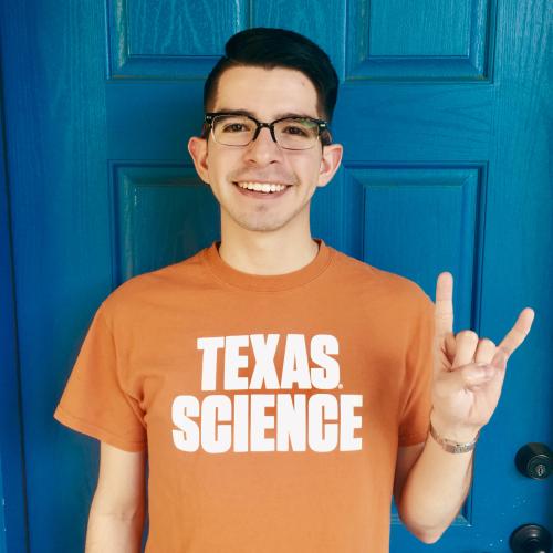 Photo of Daniel with Hook'em Horns